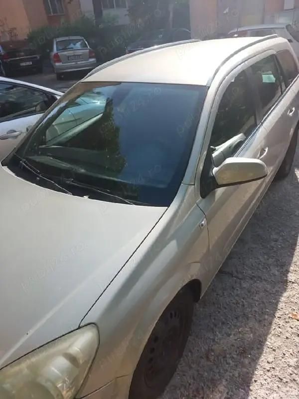 Second-hand Opel Astra 110 CP (80 kW) 2009 Auriu Coupe