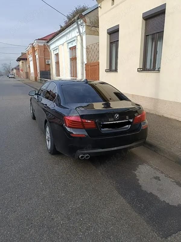 Second-hand BMW 520 190 CP (139 kW) 2014 Negru Berlinǎ