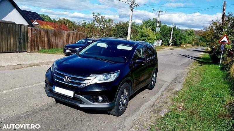 Culoarenegru Utilizat 2013 Honda CR-V Executive SUV | 9.900 EUR (Preț bun) - Imagine 1/4