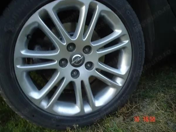 Second-hand Opel Insignia Sport 160 CP (117 kW) 2010 Gri Break