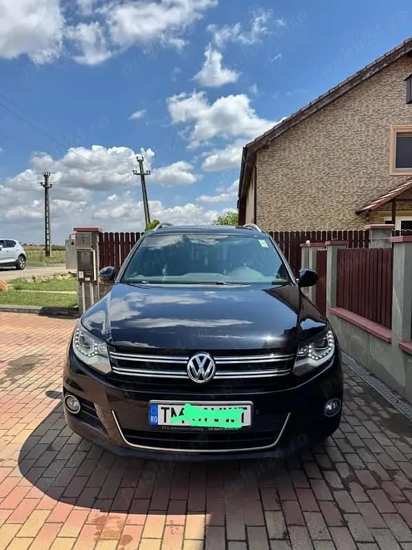 Negru Utilizat 2014 VW Tiguan Life SUV | 13.000 EUR (Preț OK) - Imagine 1/4