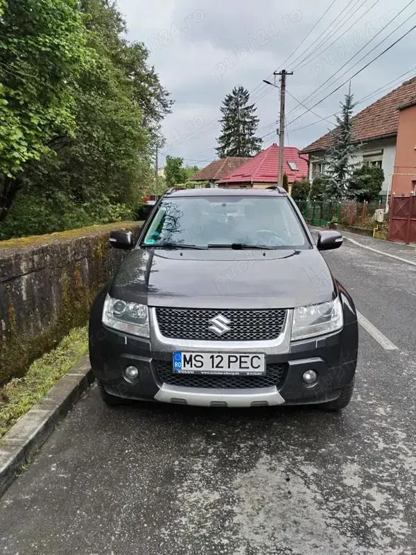 Gri Utilizat 2012 Suzuki Grand Vitara SUV | 8.890 EUR - Imagine 1/4