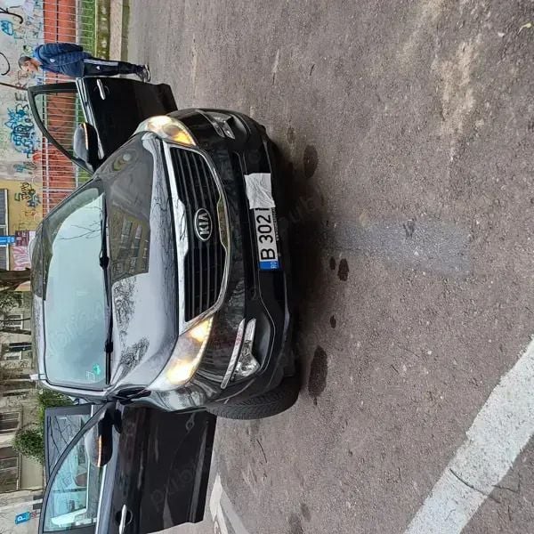 Negru Utilizat 2013 Kia Sportage SUV | 7.499 EUR (Preț bun) - Imagine 1/4