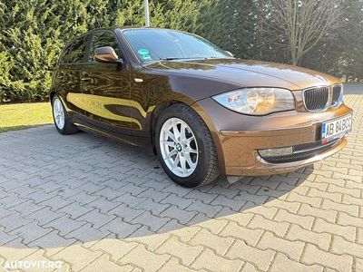 Second-hand BMW 118 Sport Line 143 CP (105 kW) 2011 Culoaremaro Hatchback