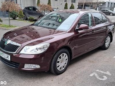 Second-hand Skoda Octavia Ambiente 105 CP (77 kW) 2011 Culoarerosu Berlinǎ