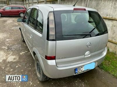 Second-hand Opel Meriva 66 CP (48 kW) 2010 Argintiu Monovolum