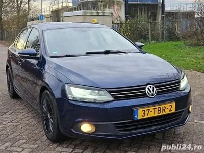 Second-hand VW Jetta 105 CP (77 kW) 2012 Albastru Berlinǎ