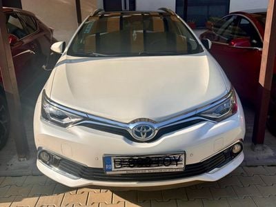 Second-hand Toyota Auris Hybrid 99 CP (72 kW) 2017 Alb Break