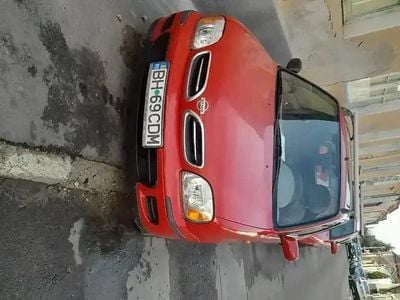 Second-hand Nissan Micra 60 CP (44 kW) 2001 Rosu Hatchback