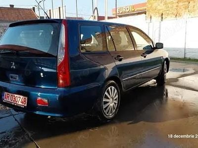 Second-hand Mitsubishi Lancer Invite 98 CP (72 kW) 2004 Negru Berlinǎ