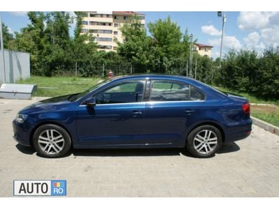 Second-hand VW Jetta 105 CP (77 kW) 2011 Albastru Berlinǎ