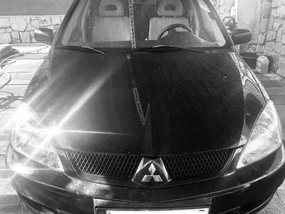 Second-hand Mitsubishi Lancer 102 CP (75 kW) 2008 Negru Berlinǎ