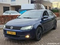 Second-hand VW Jetta 105 CP (77 kW) 2012 Albastru Berlinǎ