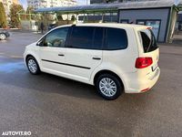 Second-hand VW Touran 115 CP (84 kW) 2014 Culoaregalbeuriu Monovolum