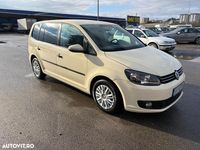 Second-hand VW Touran 115 CP (84 kW) 2014 Culoaregalbeuriu Monovolum