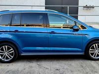 Second-hand VW Touran Highline 150 CP (110 kW) 2017 Albastru Monovolum
