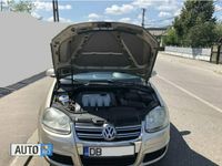 Second-hand VW Jetta 115 CP (84 kW) 2008 Auriu Berlinǎ