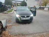 Second-hand VW Touran 105 CP (77 kW) 2009 Negru Monovolum