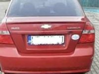 Second-hand Chevrolet Aveo 85 CP (62 kW) 2011 Roşu Berlinǎ