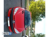 second-hand Peugeot 206 CC rosu - cutie automata - 68.000 km reali