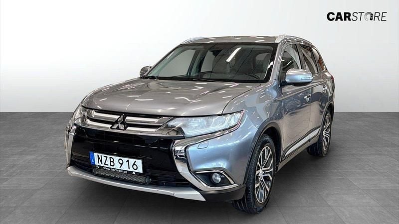 Mörkgrå (grey) Begagnad 2015 Mitsubishi Outlander SUV | 124 900 kr (Marknadspris) - Bild 1/4