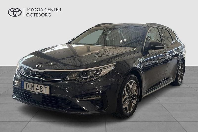 Grå Begagnad 2019 Kia Optima Hybrid Sport Sedan | 239 900 kr (Marknadspris) - Bild 1/4
