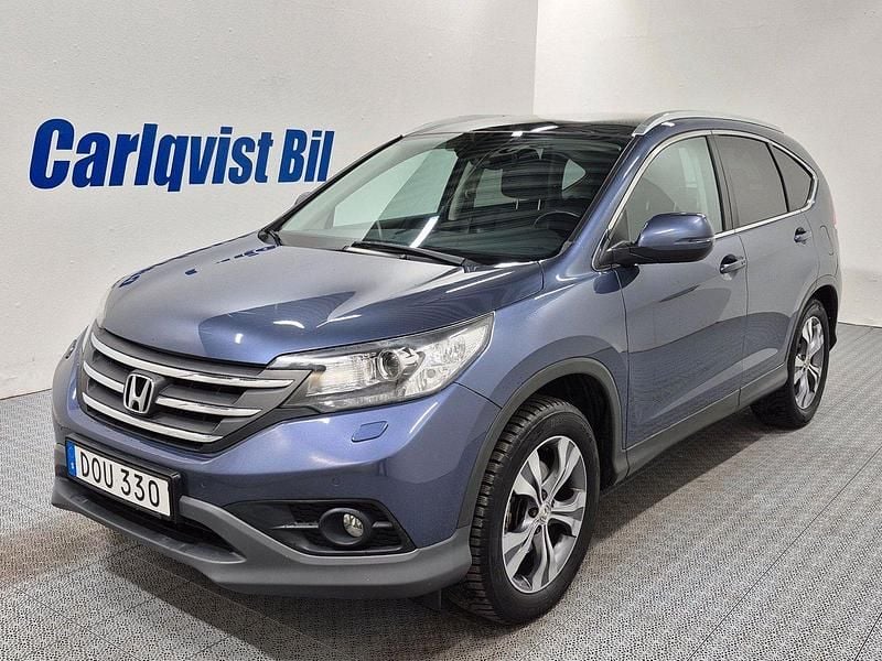 Blå (blå metallic) Begagnad 2014 Honda CR-V Executive SUV | 159 000 kr (Bra pris) - Bild 1/4