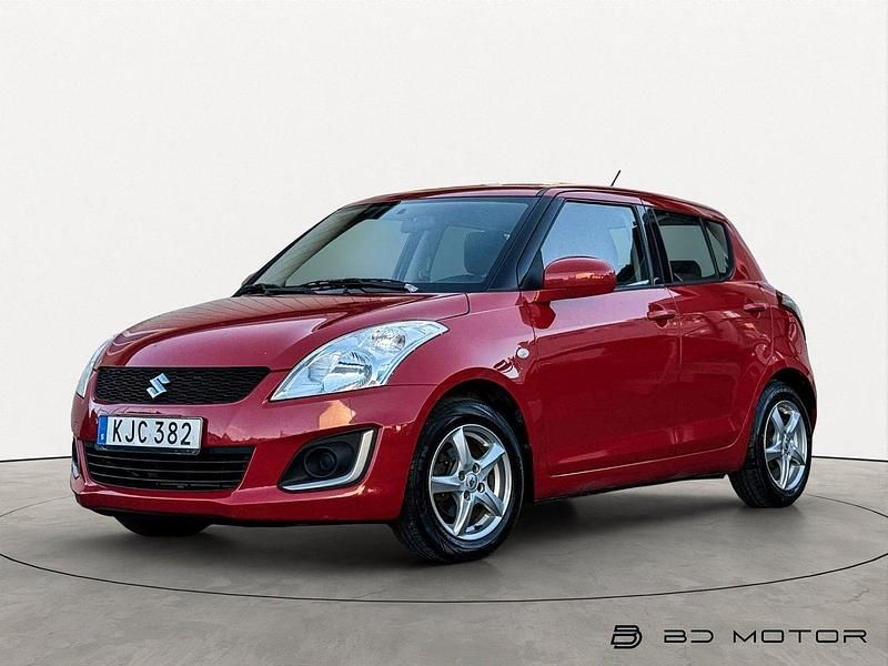 Röd Begagnad 2015 Suzuki Swift Halvkombi | 84 900 kr (Marknadspris) - Bild 1/4