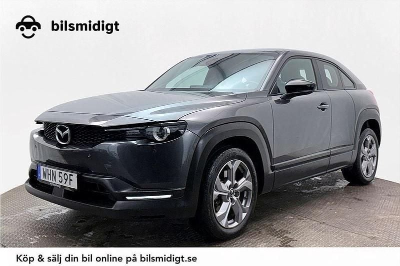 Grå Begagnad 2021 Mazda MX30 Cosmo SUV | 142 700 kr (Marknadspris) - Bild 1/3