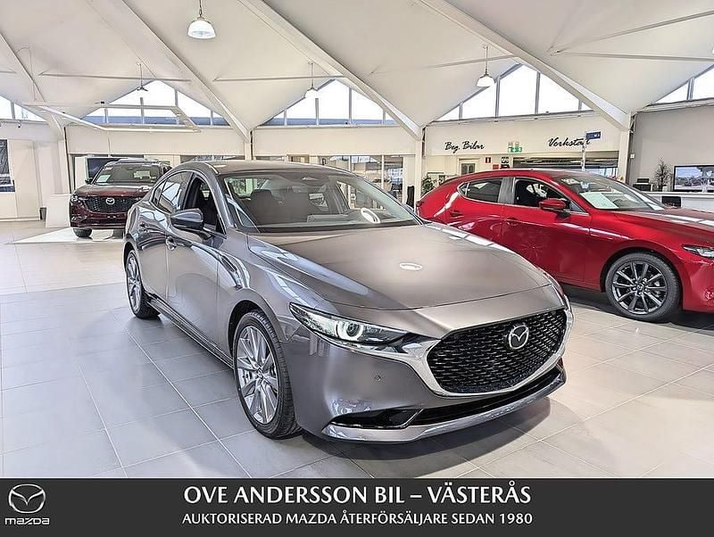 Grå Begagnad 2024 Mazda 3 Exclusive-Line Sedan | 367 600 kr (Dyr) - Bild 1/4