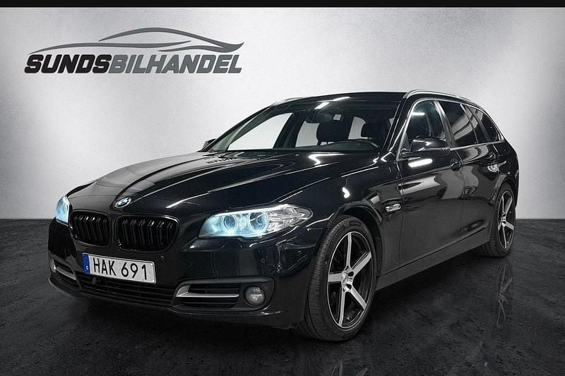 Svart Begagnad 2014 BMW 520 M Sport Kombi | 159 900 kr (Marknadspris) - Bild 1/4