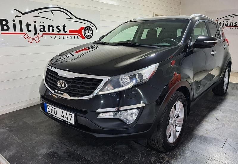 Svart Begagnad 2013 Kia Sportage Comfort SUV | 94 900 kr (Marknadspris) - Bild 1/4