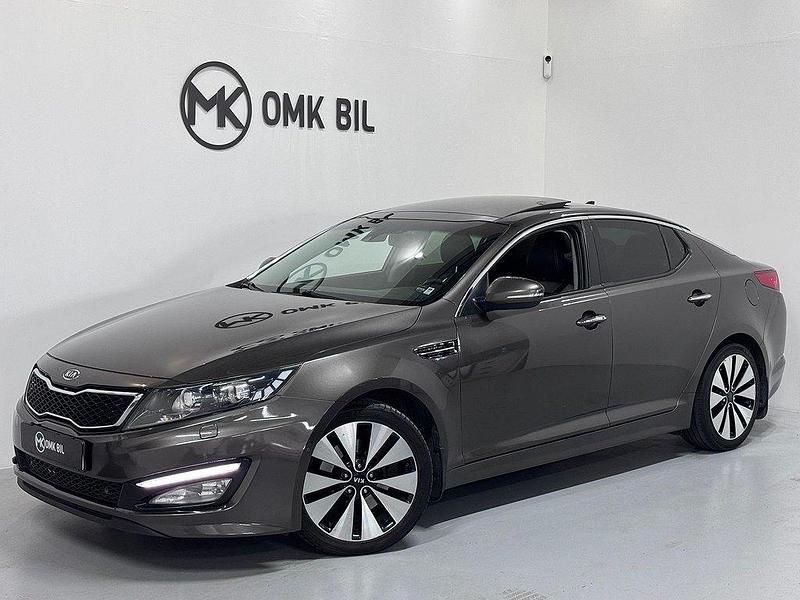 Ljusbrun (brun) Begagnad 2012 Kia Optima Sedan | 92 900 kr (Marknadspris) - Bild 1/4