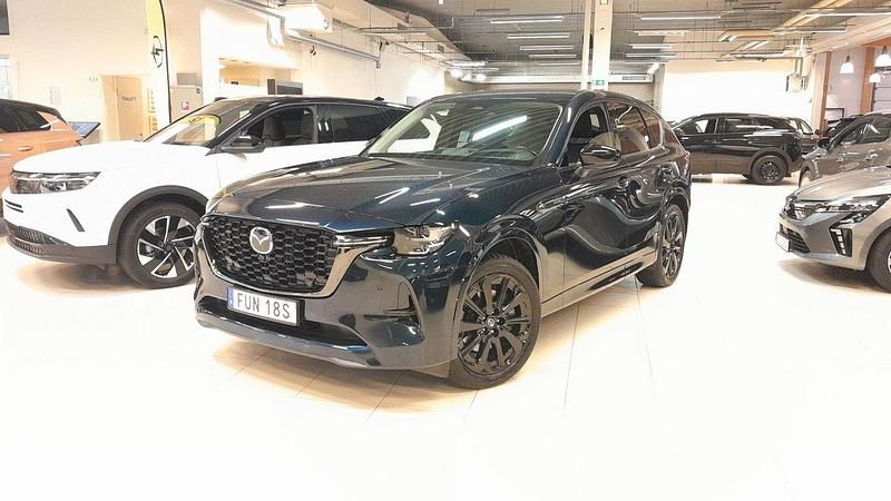 Blå (deep crystal blue metallic) Begagnad 2022 Mazda CX-60 Homura-Line SUV | 444 900 kr (Marknadspris) - Bild 1/4