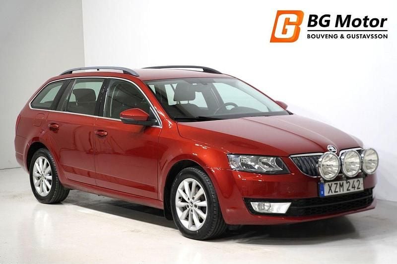 Röd Begagnad 2014 Skoda Octavia Ambition Kombi | 79 700 kr (Marknadspris) - Bild 1/4