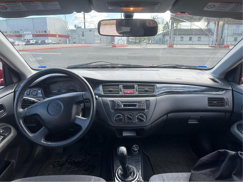 Röd Begagnad 2004 Mitsubishi Lancer Kombi | 25 000 kr (Marknadspris) - Bild 1/4