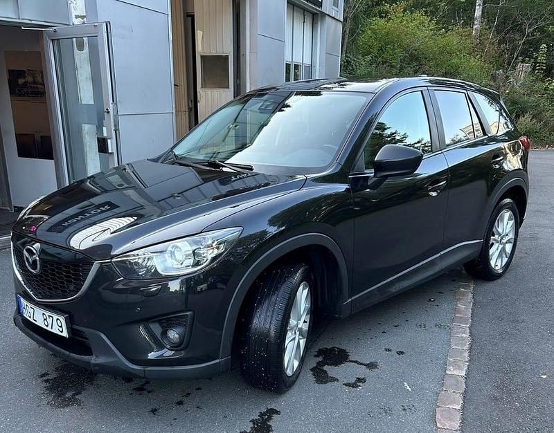Svart metallic Begagnad 2013 Mazda CX-5 SUV | 79 000 kr (Bra pris) - Bild 1/4