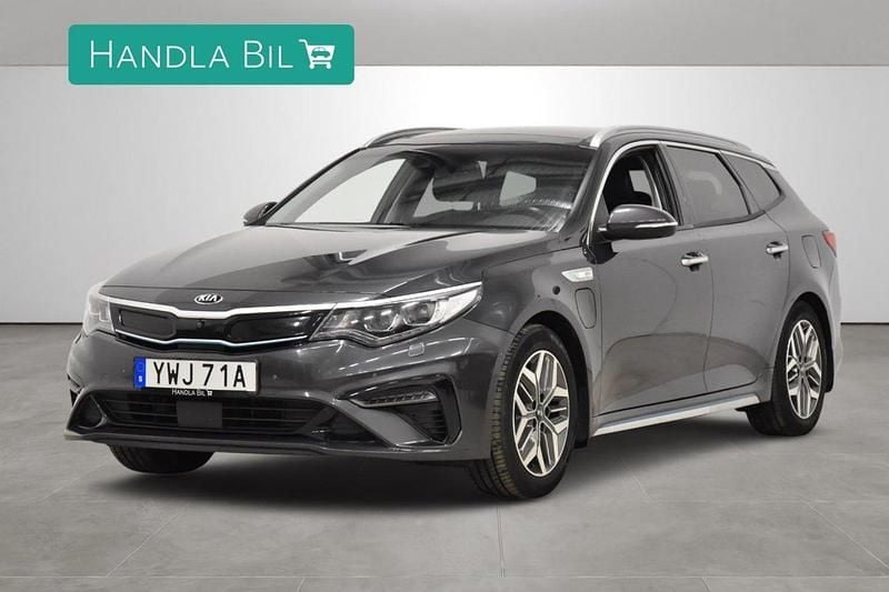 Grå Begagnad 2019 Kia Optima Hybrid Sedan | 199 700 kr (Marknadspris) - Bild 1/4