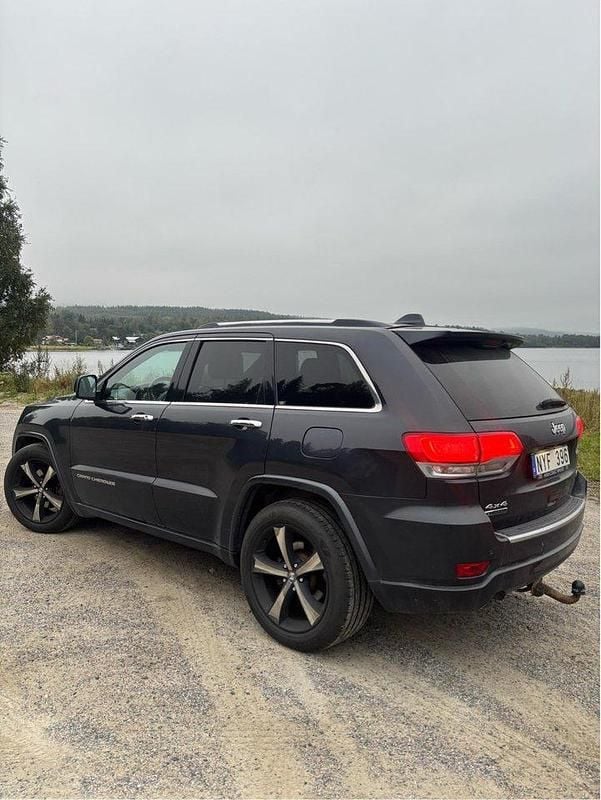 Blå Begagnad 2014 Jeep Grand Cherokee SUV | 185 000 kr (Marknadspris) - Bild 1/4