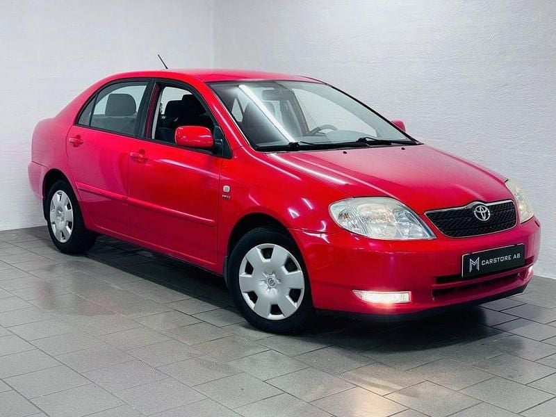 Röd Begagnad 2004 Toyota Corolla Sedan | 49 900 kr (Marknadspris) - Bild 1/4