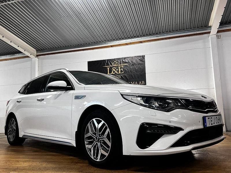 Vit Begagnad 2018 Kia Optima Hybrid Sedan | 159 900 kr (Marknadspris) - Bild 1/4