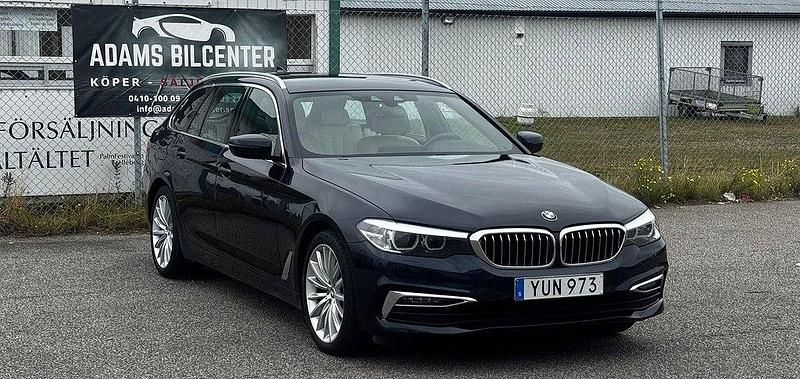 Blå Begagnad 2018 BMW 520 Kombi | 268 400 kr (Marknadspris) - Bild 1/4