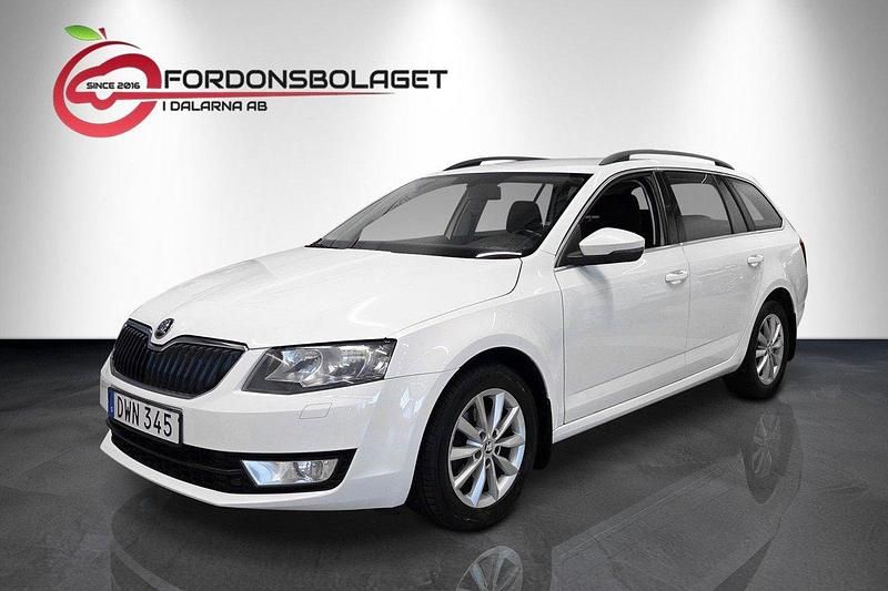 Vit Begagnad 2014 Skoda Octavia Ambition Kombi | 89 800 kr (Marknadspris) - Bild 1/4