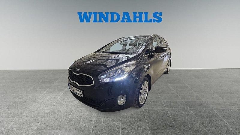 Svart Begagnad 2013 Kia Carens Comfort Minibuss | 159 000 kr (Marknadspris) - Bild 1/4