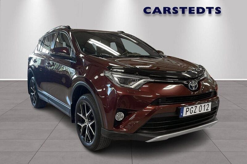 Mörkröd Begagnad 2017 Toyota RAV4 Hybrid SUV | 249 900 kr (Marknadspris) - Bild 1/4