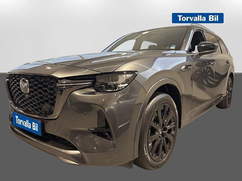 Grå Begagnad 2024 Mazda CX-80 Homura-Line SUV | 579 000 kr (Marknadspris) - Bild 1/4