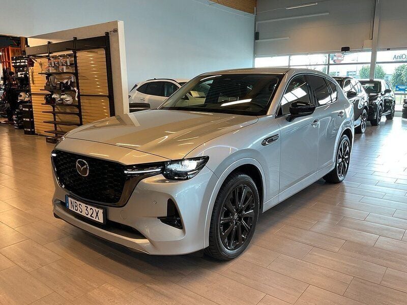 Grå Begagnad 2023 Mazda CX-60 Homura-Line SUV | 498 000 kr (Marknadspris) - Bild 1/4