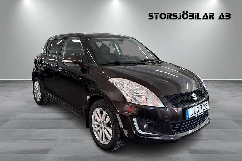 Brun Begagnad 2014 Suzuki Swift Halvkombi | 99 000 kr (Lite dyr) - Bild 1/4