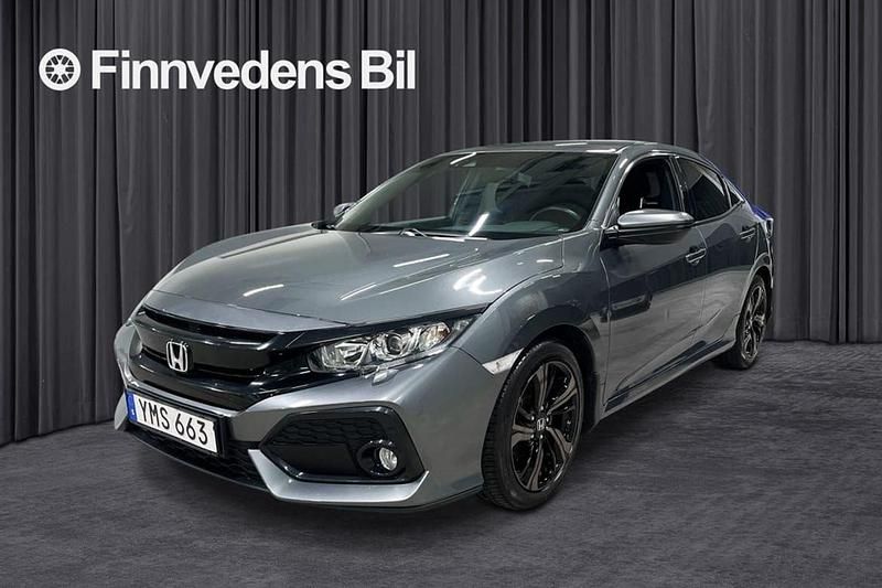 Mörkgrå (grå) Begagnad 2017 Honda Civic Halvkombi | 185 000 kr (Marknadspris) - Bild 1/4
