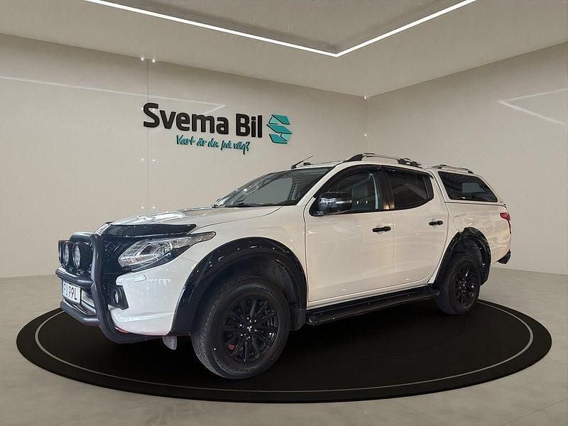 White peral metallic Begagnad 2019 Mitsubishi L200 Pickup | 274 875 kr (Marknadspris) - Bild 1/4